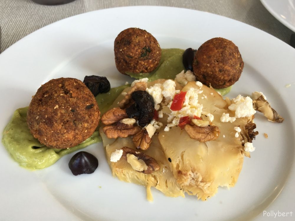 oven-baked celery with falaffel, avocado cream, black nuts and feta